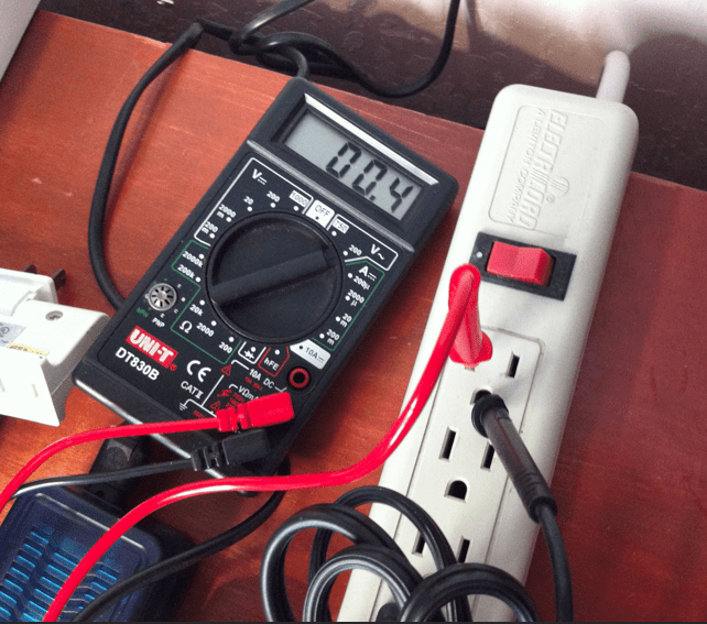 neutral to earth/ground voltage measured using a multimeter.